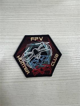 {{photo.Alt || photo.Description || 'Шеврон FPV Hunter Club шестиугольник'}}